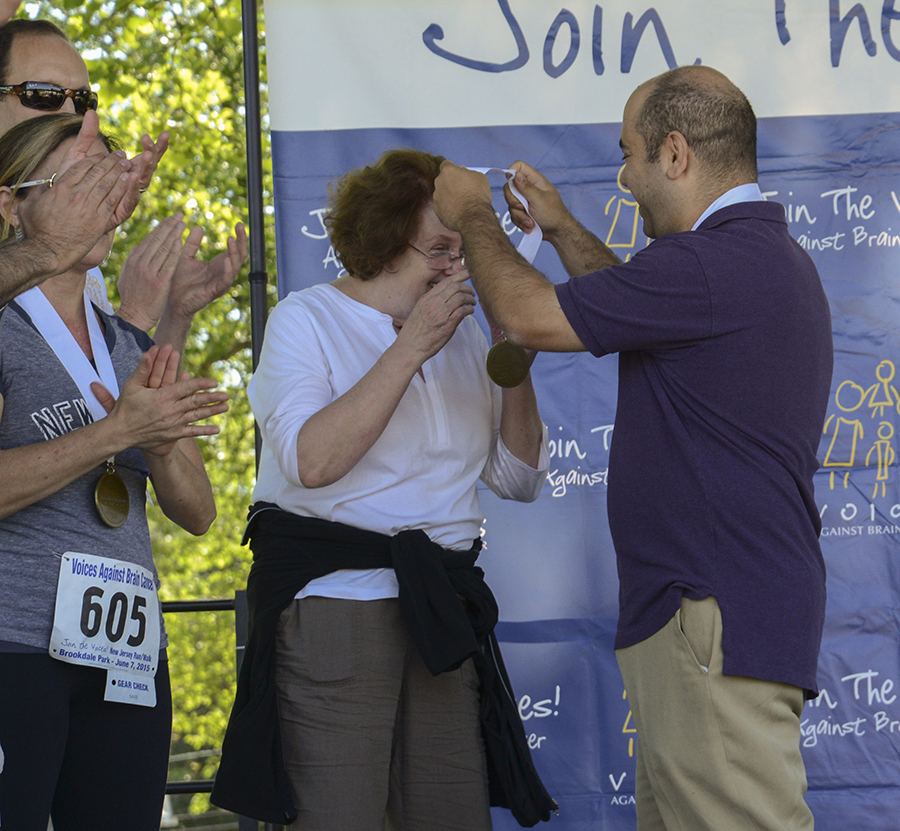 Simon Hanft, MD awards the medal to Catherine Furnbach, RN