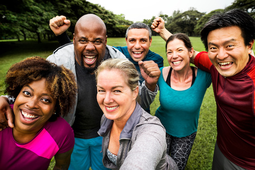 Group of cheerful diverse adults in the park