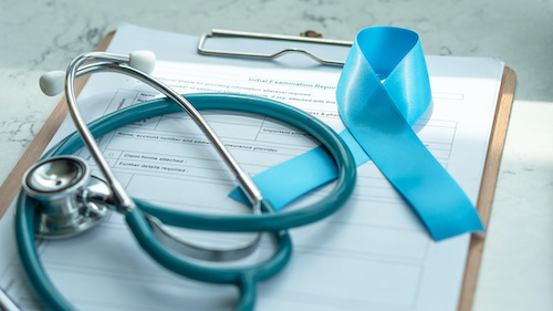 Blue awareness ribbon for prostate cancer with light blue stethoscope color on medical doctor record