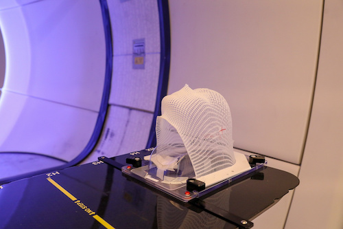 proton therapy fixing mask showing laser lines for targeting cancer cells in the brain