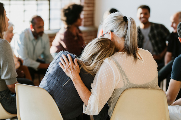 People support each other in a group session