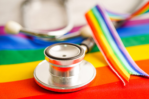 stethoscope sitting on a pride flag