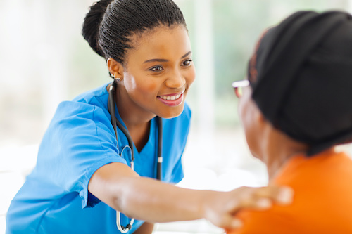 african american medical nurse comforting senior patient