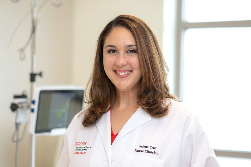 photo of nurse Arlene Cruz in white jacket
