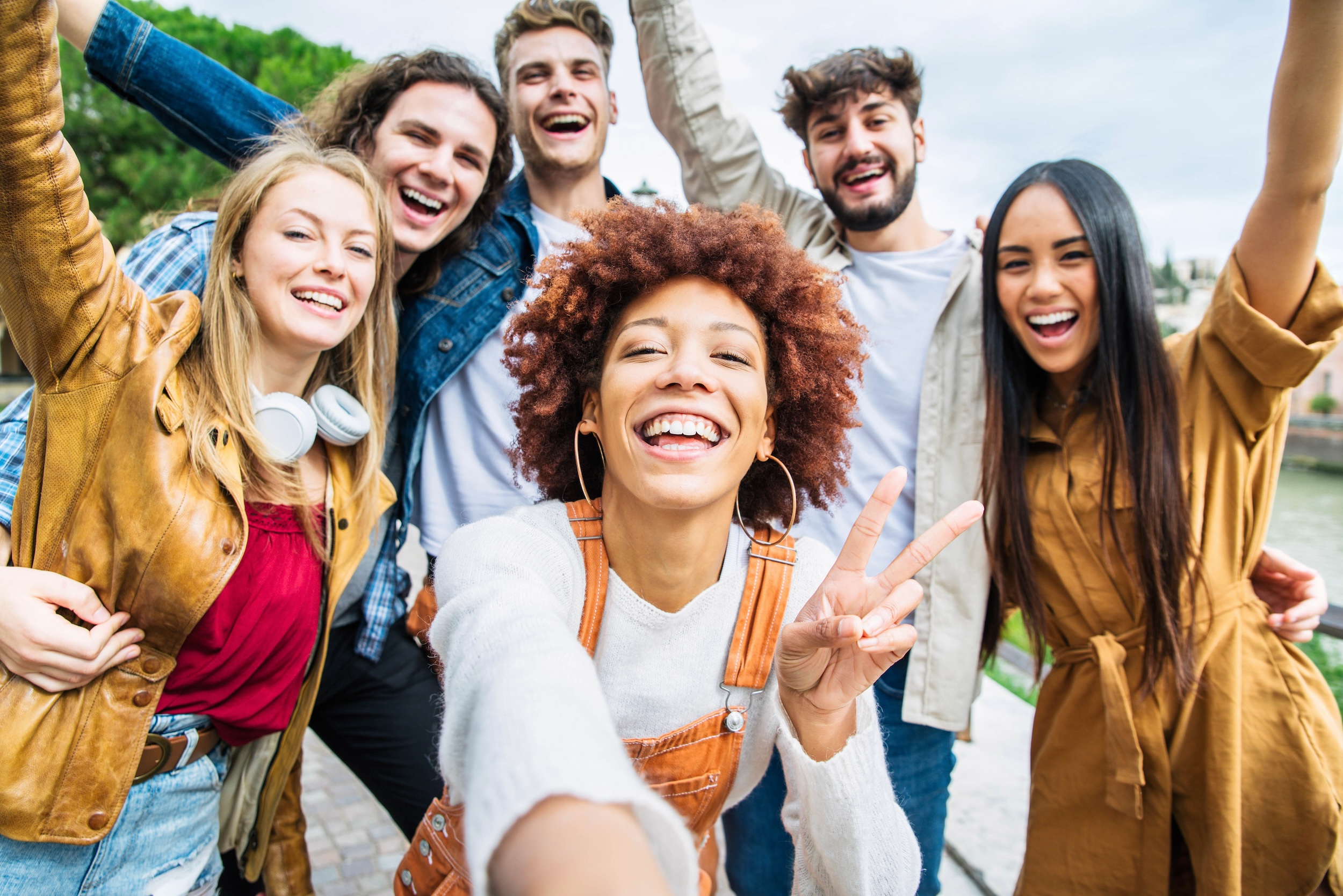 Diverse group of young people smiling at camera