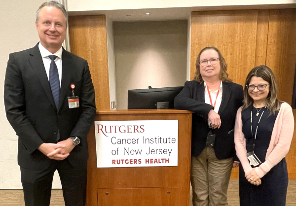 Dr. Evens, Dr. White and Linda Tanzer Standing at Town Hall Podium