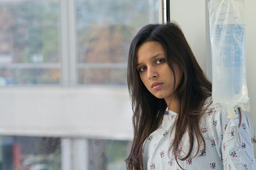 Indian woman in hospital gown