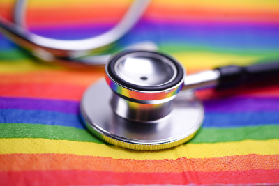 Stethoscope with rainbow colors behind it