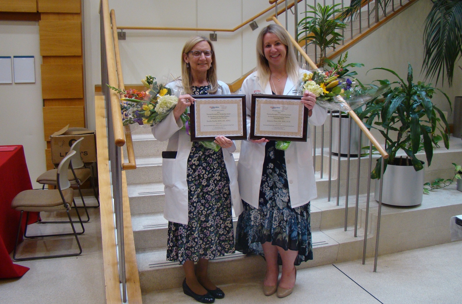 Nursing award winners standing with their certificates