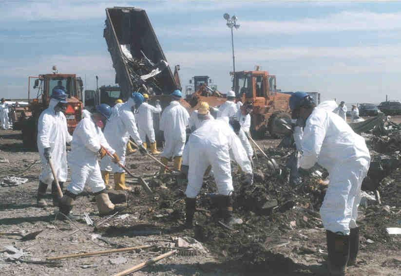 group of people in hazmat gear