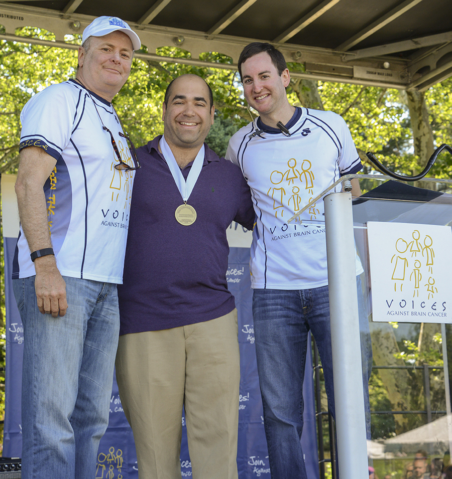 Simon Hanft, MD receives his award from Voices Against Brain Cancer leaders