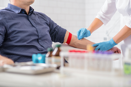 nurse drawing patient blood