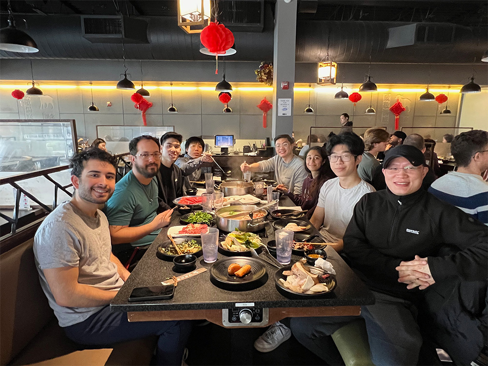 Small group sitting together in a booth at Taijin Lan