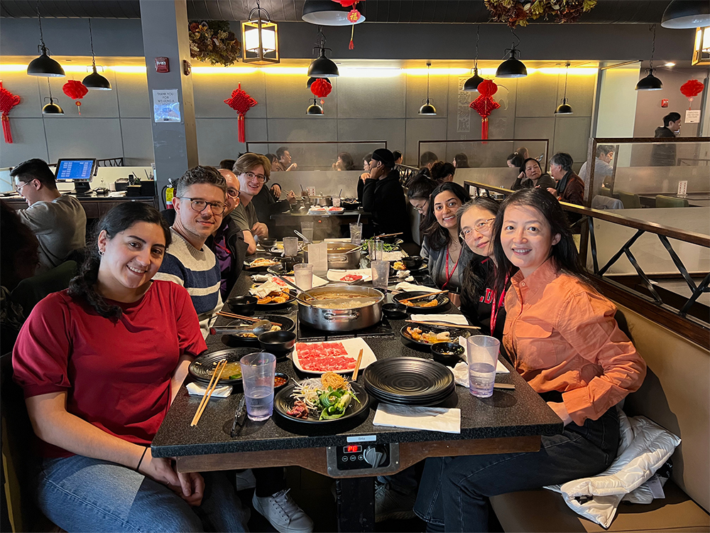 Small group sitting together in a booth at Taijin Lan