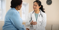 Image of a female doctor speaking with a female patient