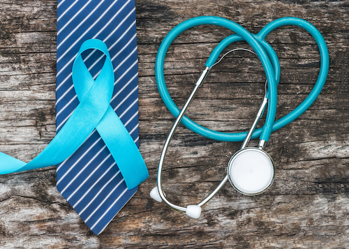 blue prostate cancer ribbon on top of blue tie