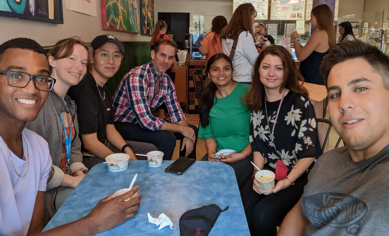 group of people sitting at table in restaurant