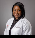 Darria Lloyd in white coat